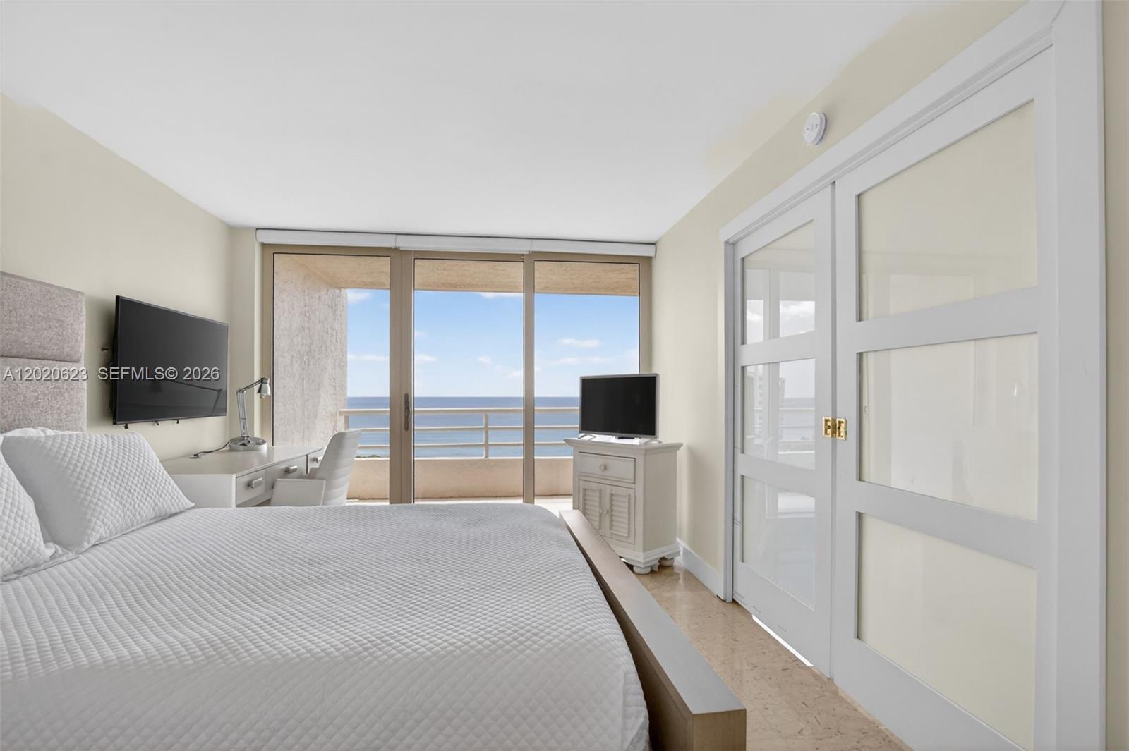 4101 North Ocean Boulevard, Unit 1605 Boca Raton, FL 33431 - Photo 18 of 35 a bedroom with a bed and a flat screen tv