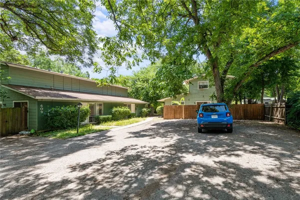 a view of a car parked in front of a house