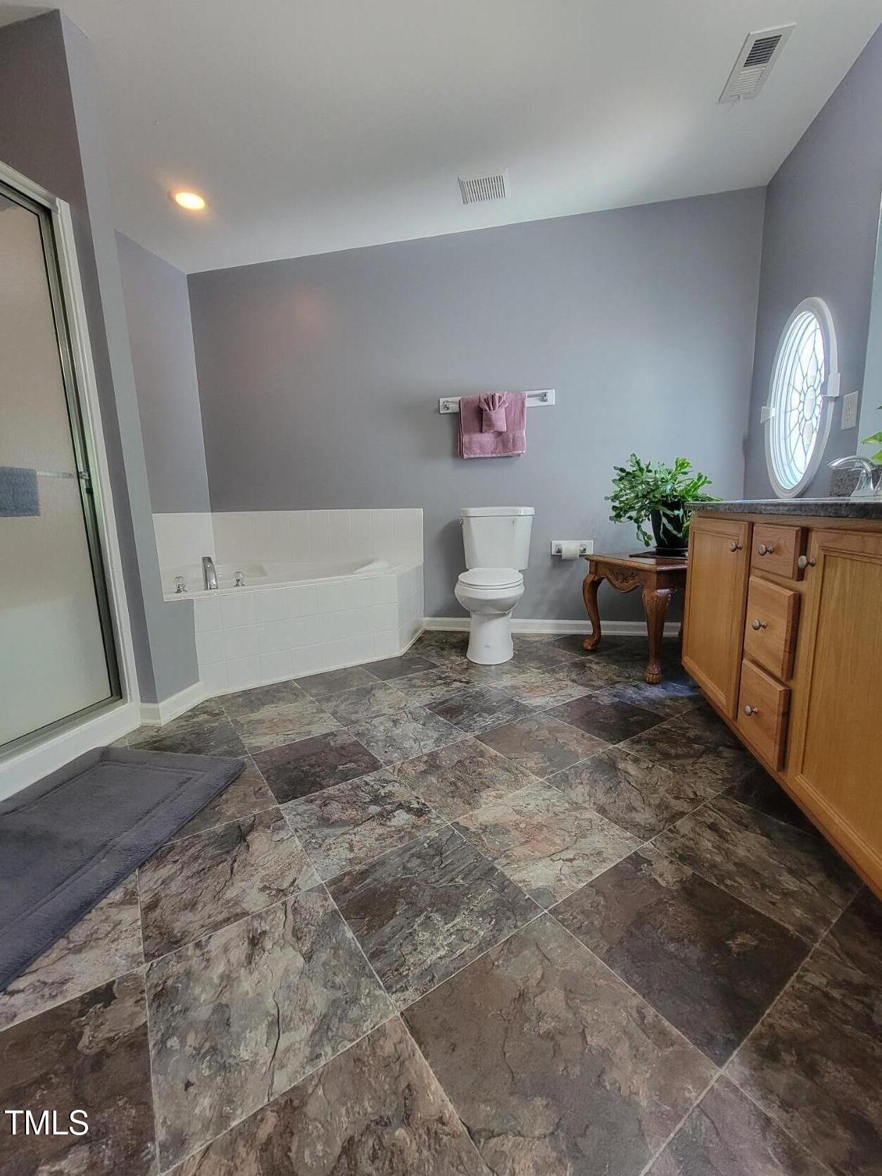 5126 Thornton Knoll Way Raleigh, NC 27616 - Photo 22 of 23 Primary bath2