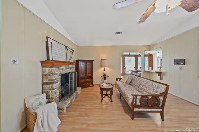 a living room with furniture and a fireplace