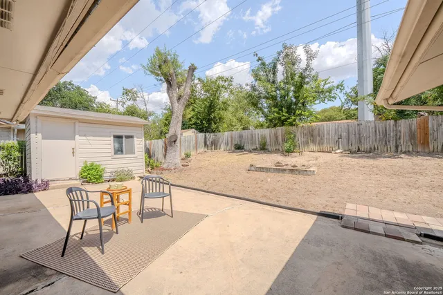 a view of a backyard with a patio