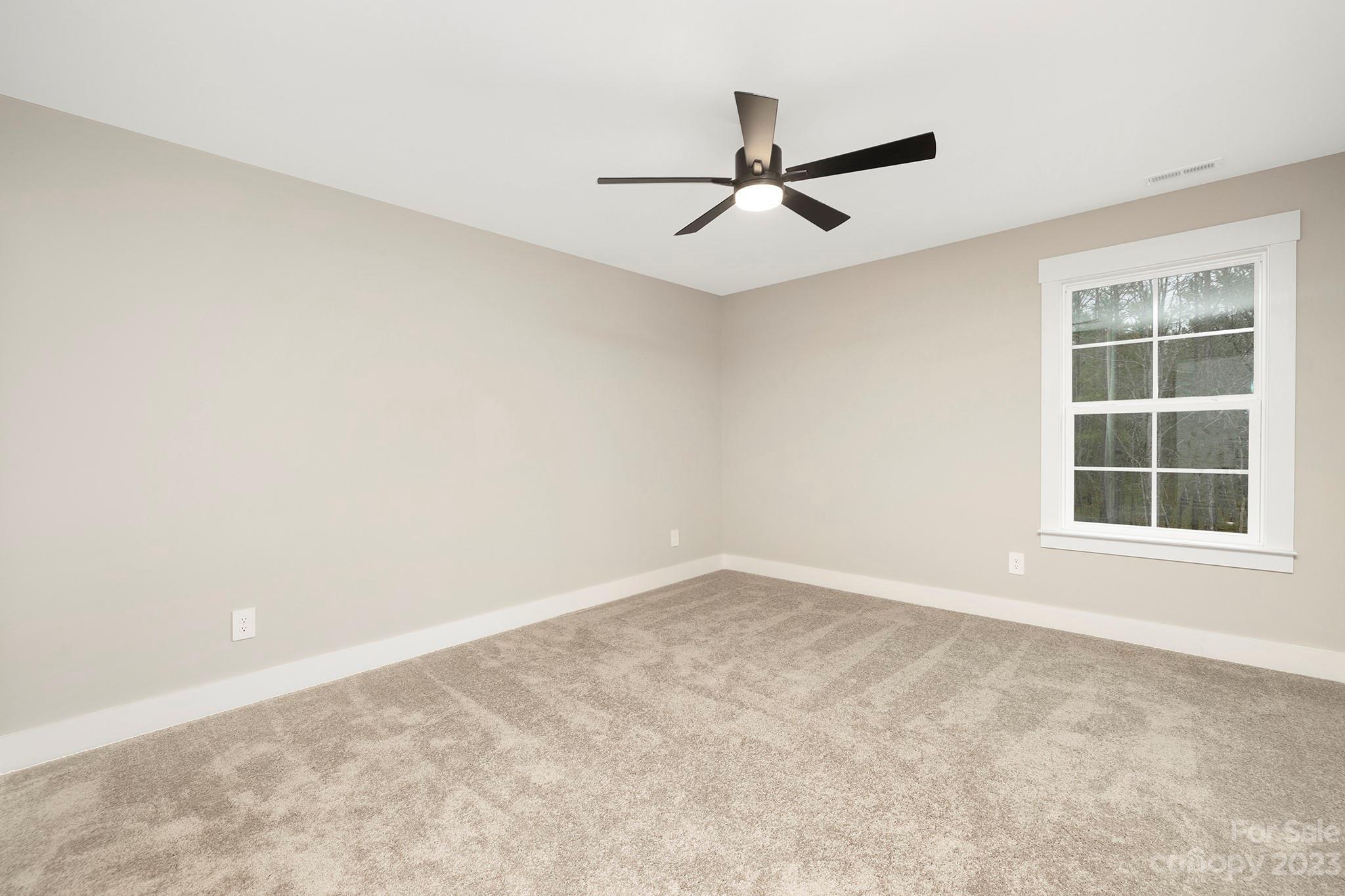 1712 Greyfox Estates Road Lancaster, SC 29720 - Photo 23 of 32 an empty room with a window and a fan