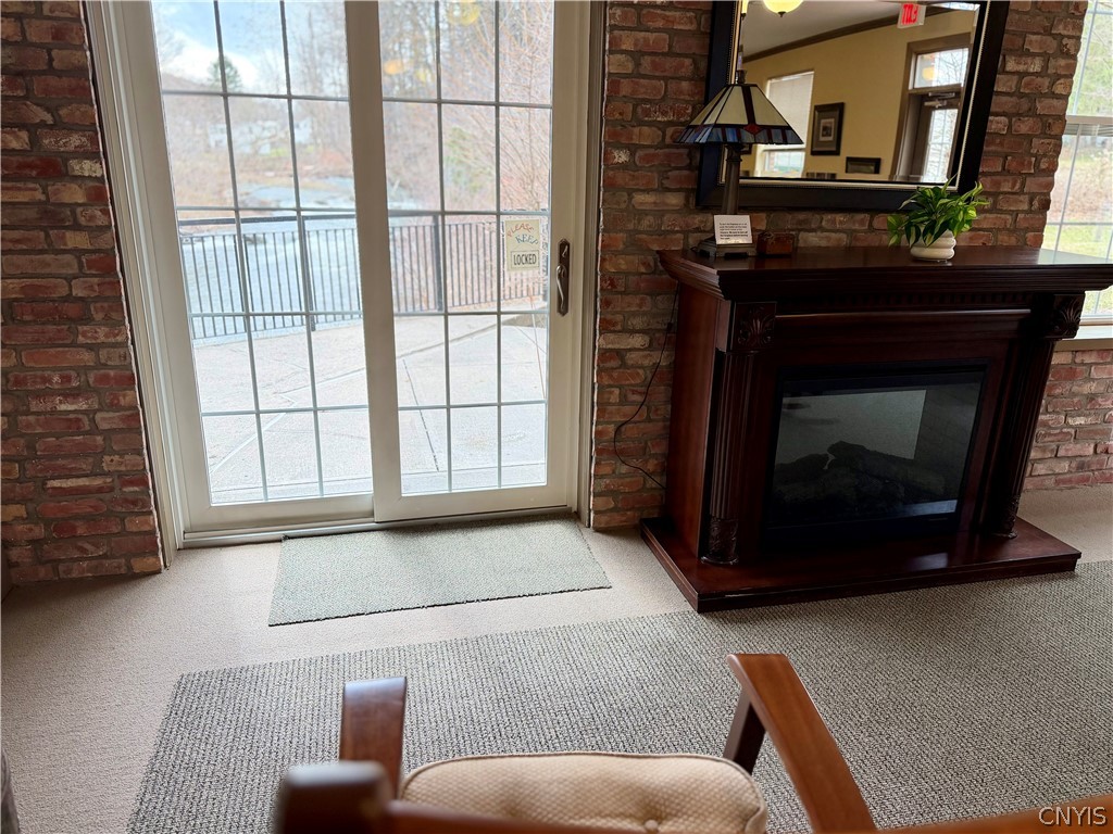 28 Maple Street, Unit 103 Marcellus, NY 13108 - Photo 33 of 41 Common meeting area-Fireplace and slider to Creeks