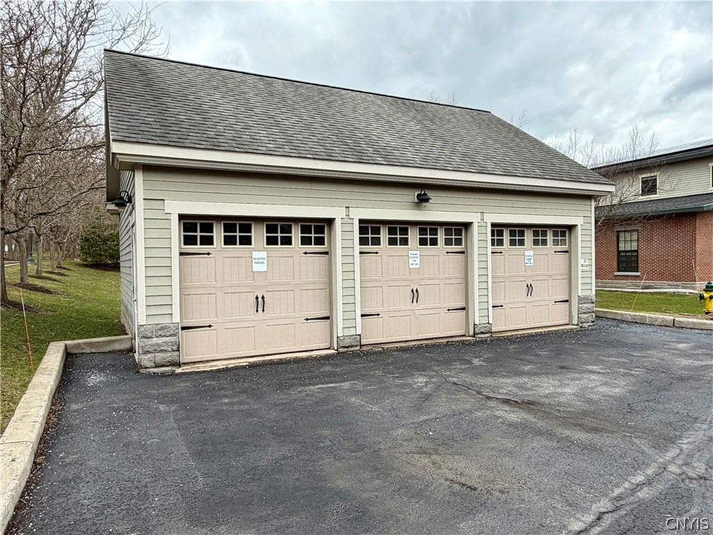 28 Maple Street, Unit 103 Marcellus, NY 13108 - Photo 39 of 41 3 Car Garage outside #103. Middle garage is seller
