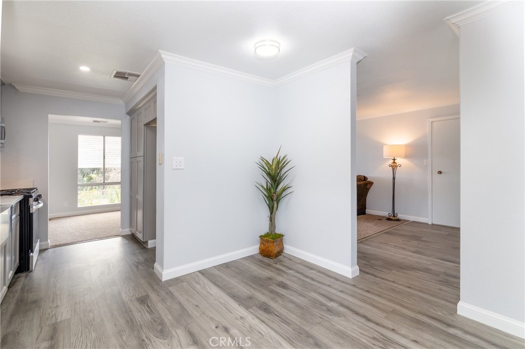 24363 Briggs Road Menifee, CA 92585 - Photo 13 of 43 a view of a big room with wooden floor and a window