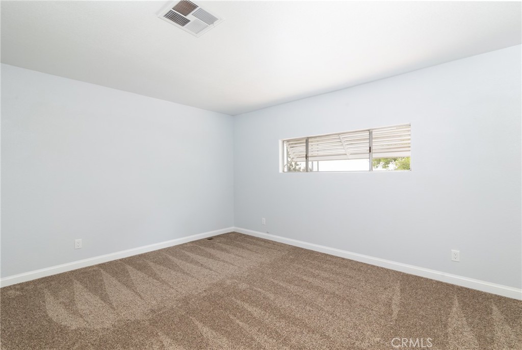 24363 Briggs Road Menifee, CA 92585 - Photo 14 of 43 an empty room with windows