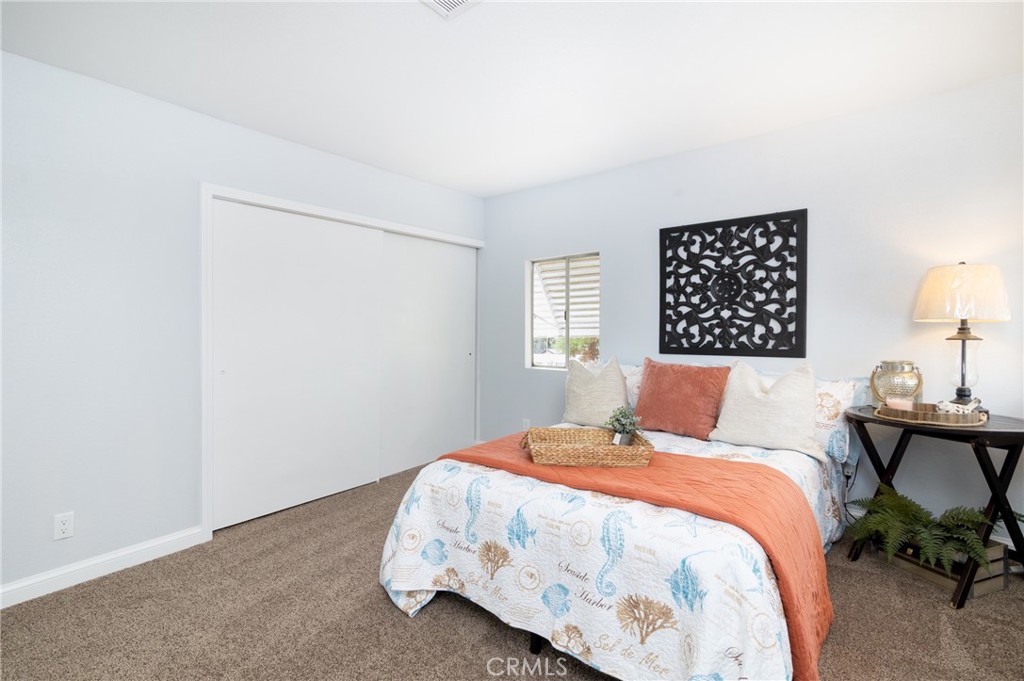 24363 Briggs Road Menifee, CA 92585 - Photo 20 of 43 a bedroom with a bed and wooden floor