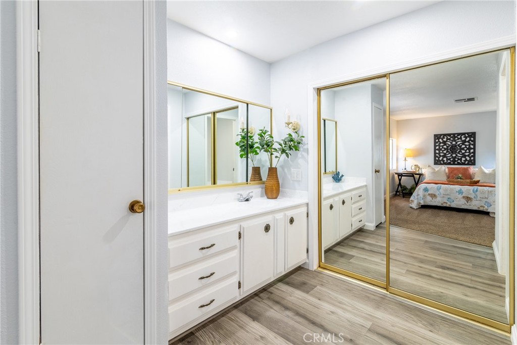 24363 Briggs Road Menifee, CA 92585 - Photo 21 of 43 a bathroom with a double vanity sink and mirror