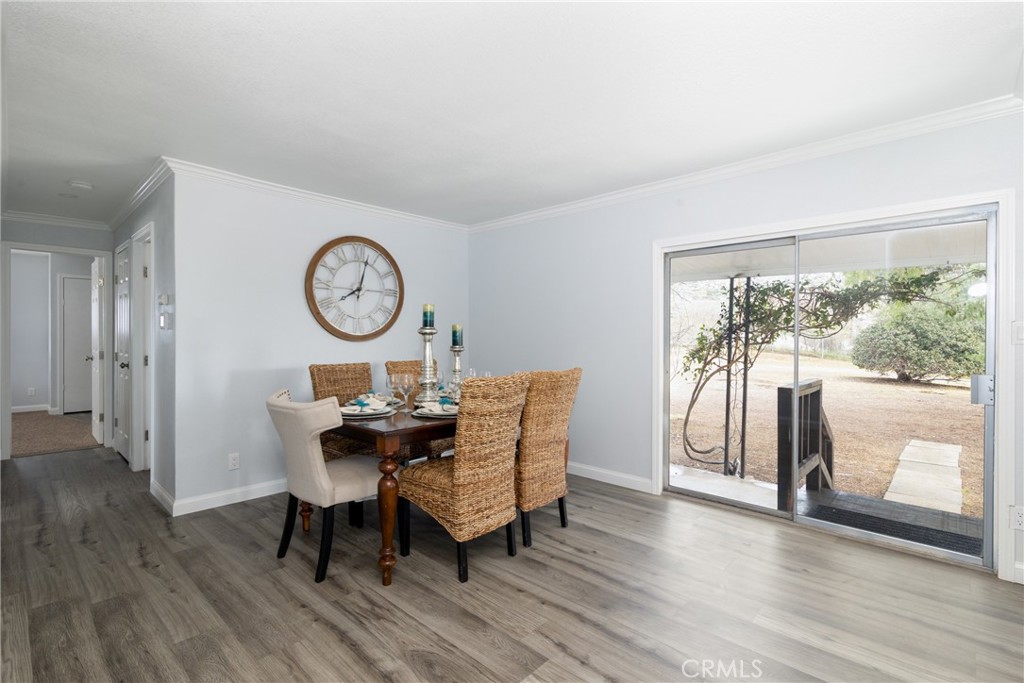 24363 Briggs Road Menifee, CA 92585 - Photo 3 of 43 a view of a dining room with furniture window and wooden floor
