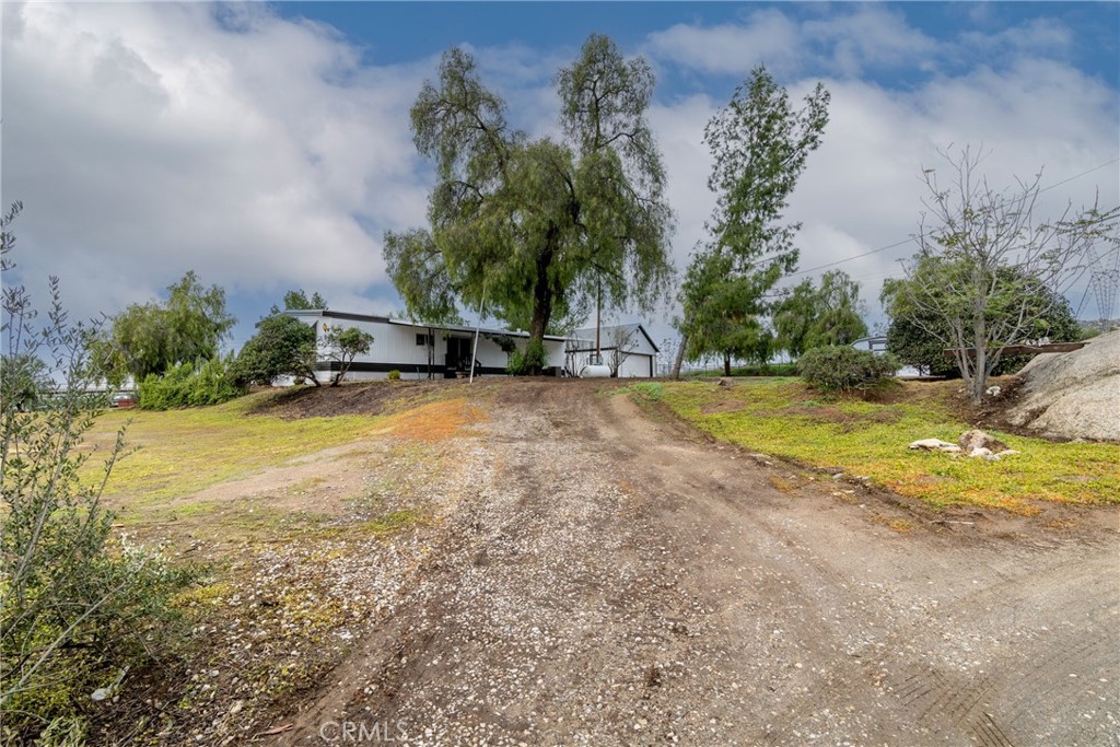 24363 Briggs Road Menifee, CA 92585 - Photo 35 of 43 a view of a swimming pool with a yard