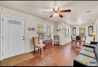 1017 South 6th Street Temple, TX 76504 - Photo 4 of 13 a living room with furniture and a wooden floor