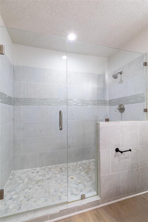 6192 Wrigley Way Fort Worth, TX 76133 - Photo 13 of 22 a bathroom with a shower