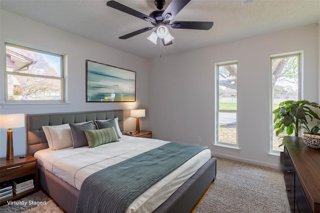 6192 Wrigley Way Fort Worth, TX 76133 - Photo 16 of 22 a bedroom with bed and window