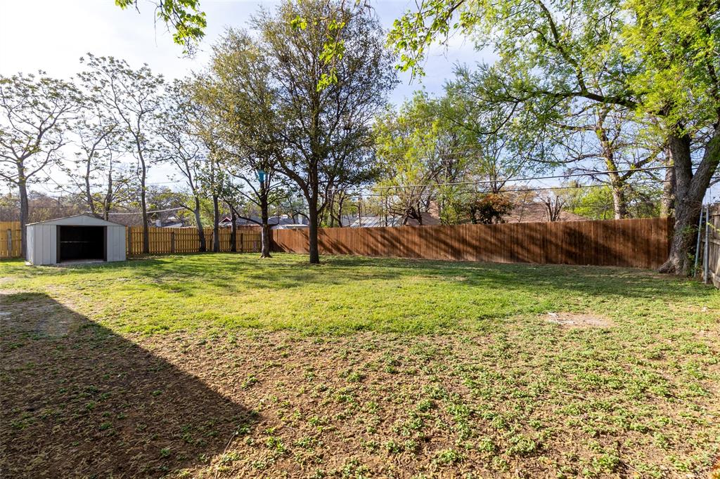6192 Wrigley Way Fort Worth, TX 76133 - Photo 21 of 22 a view of a backyard with large trees