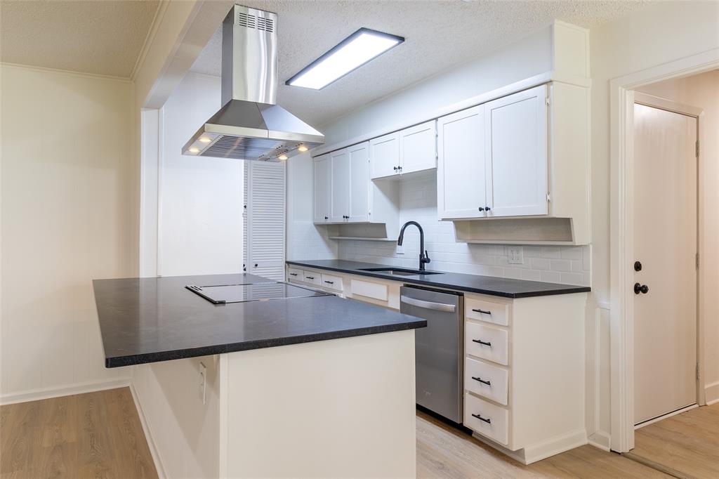 6192 Wrigley Way Fort Worth, TX 76133 - Photo 5 of 22 a kitchen with stainless steel appliances granite countertop a sink stove and refrigerator