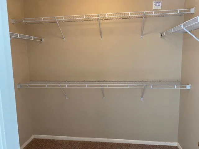 a view of a room with racks on the wall
