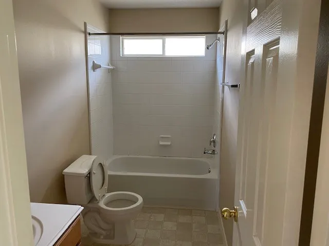 a bathroom with a tub and a sink