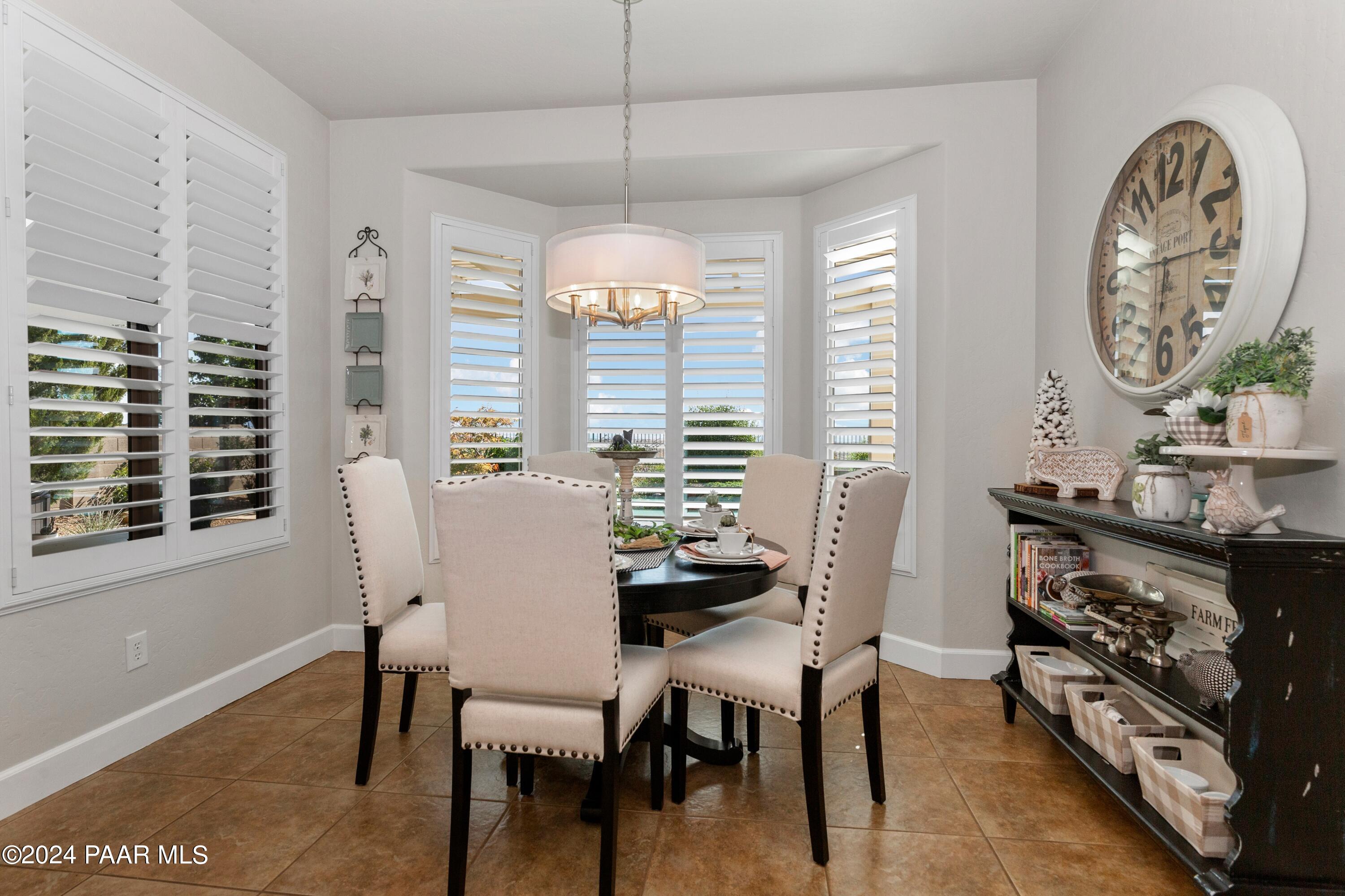 1219 Stack Rock Road Prescott Valley, AZ 86314 - Photo 12 of 41 a view of a dining room with furniture window and outside view