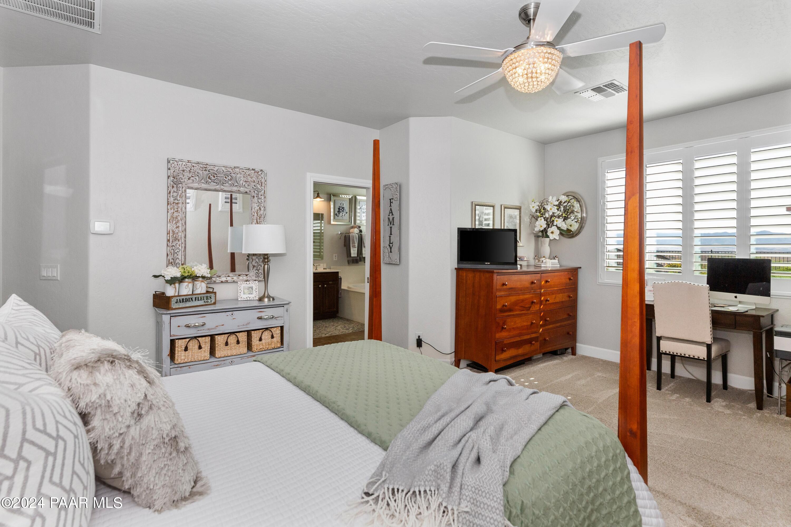 1219 Stack Rock Road Prescott Valley, AZ 86314 - Photo 16 of 41 a bedroom with a bed and a television in it
