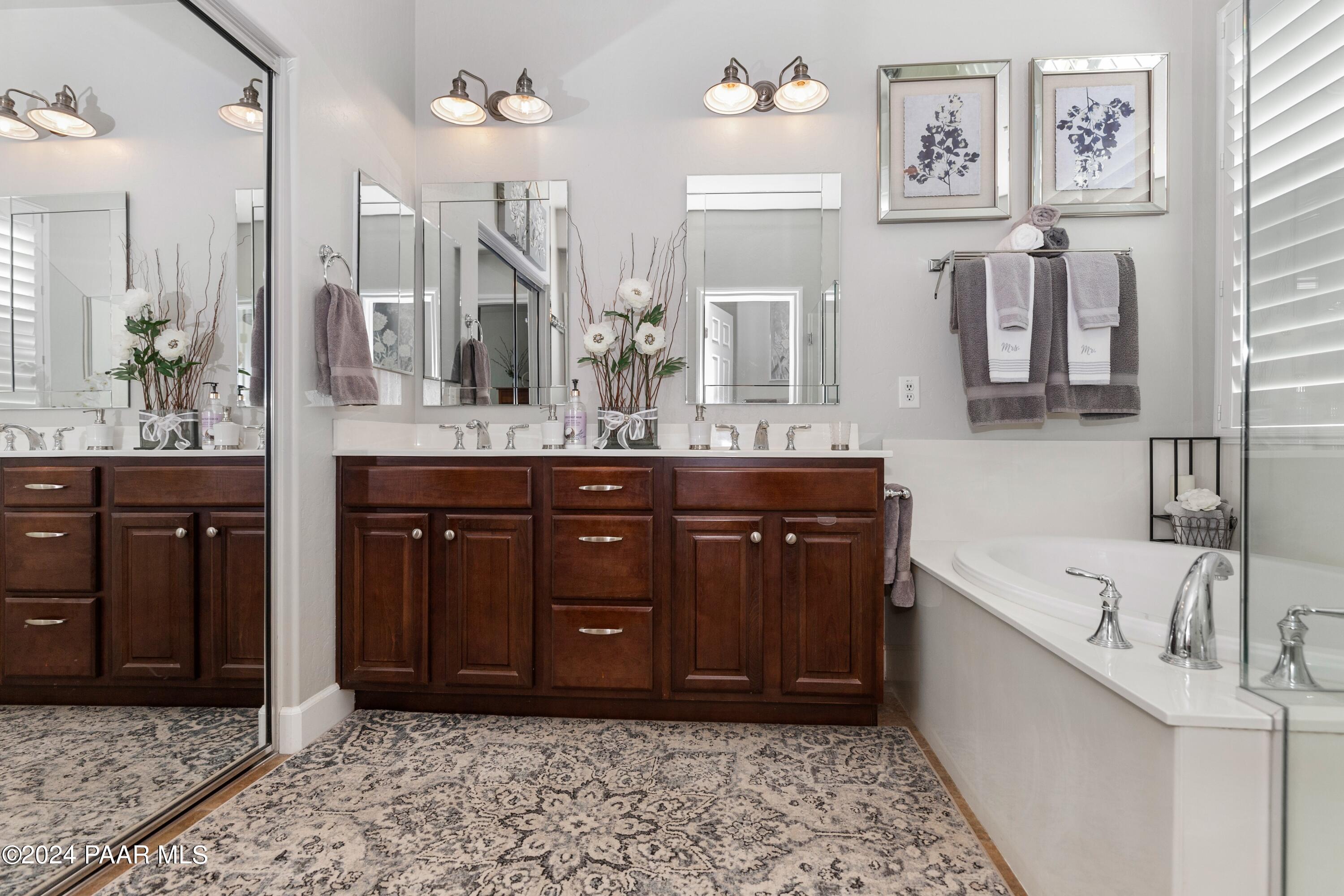 1219 Stack Rock Road Prescott Valley, AZ 86314 - Photo 18 of 41 a spacious bathroom with a tub sink and mirror