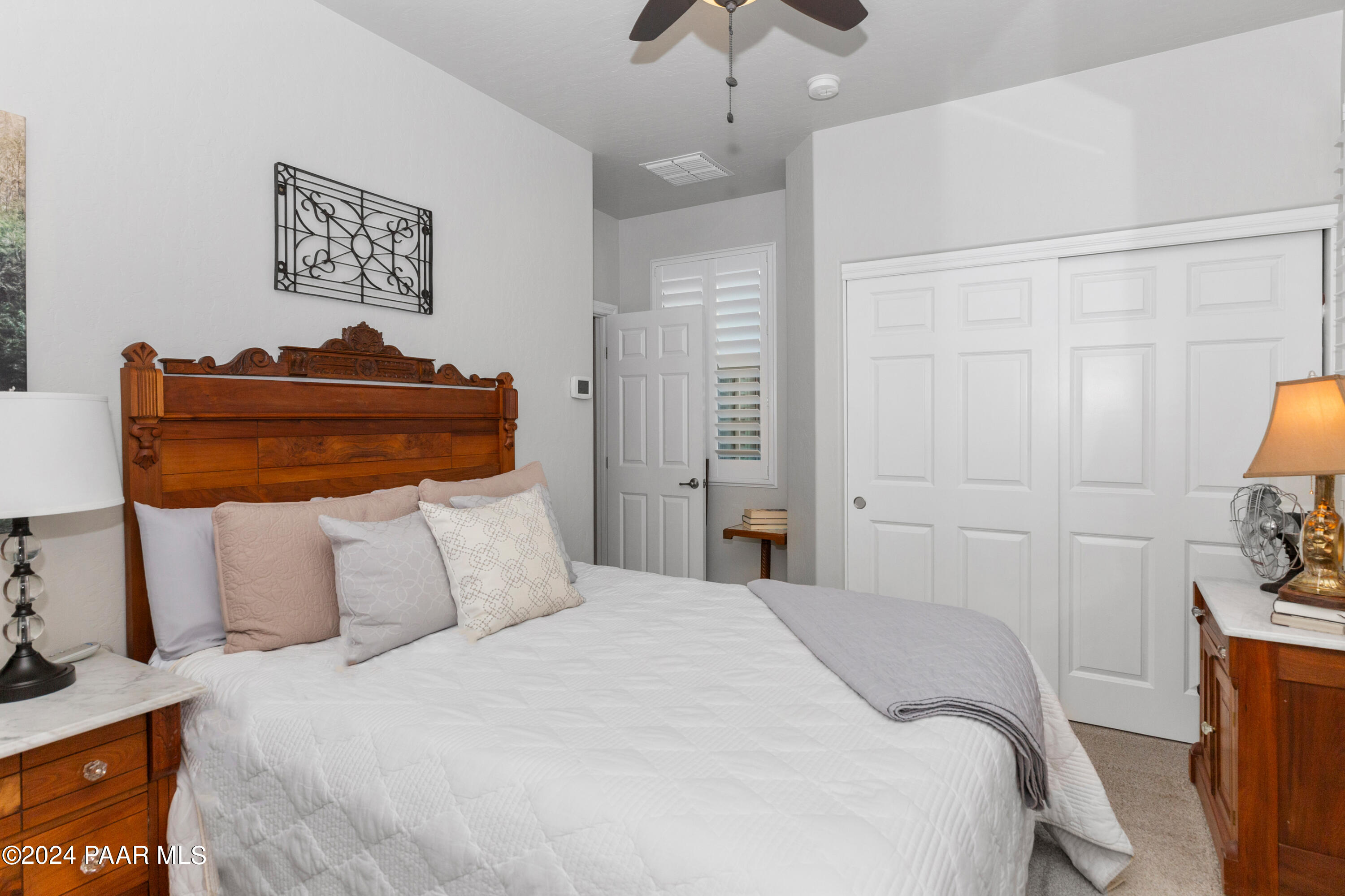 1219 Stack Rock Road Prescott Valley, AZ 86314 - Photo 21 of 41 a bedroom with a bed and a night stand