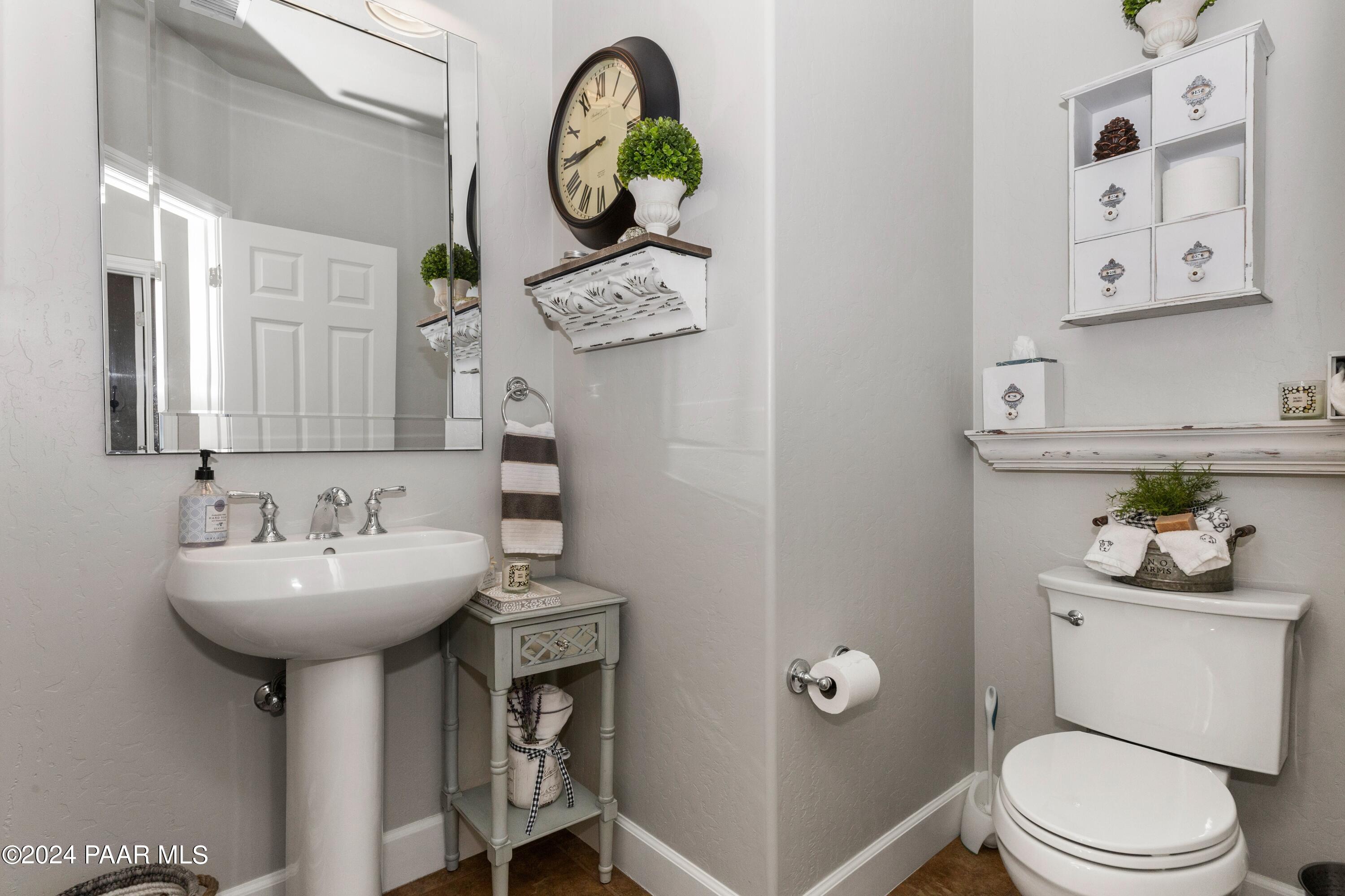1219 Stack Rock Road Prescott Valley, AZ 86314 - Photo 26 of 41 a bathroom with a sink toilet and a mirror