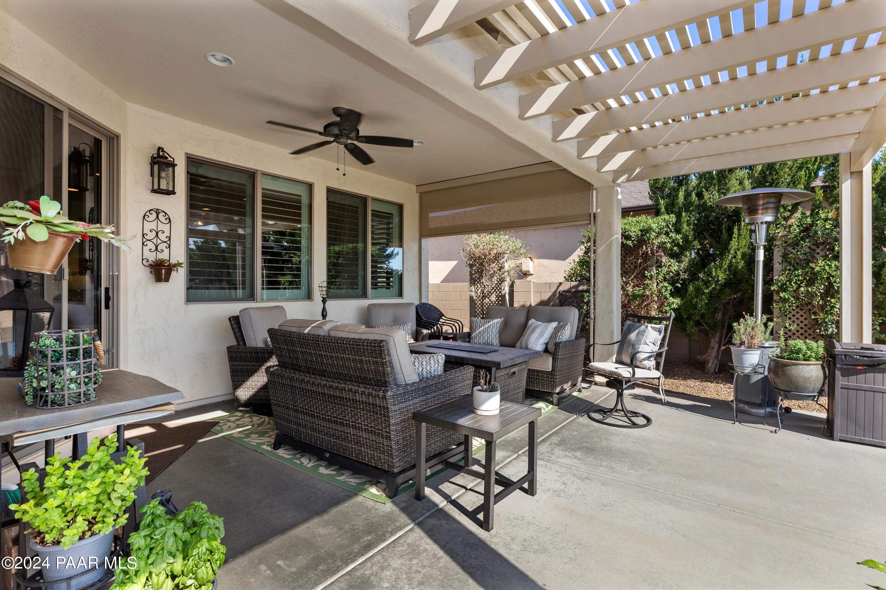 1219 Stack Rock Road Prescott Valley, AZ 86314 - Photo 29 of 41 a living room with patio furniture and a potted plant