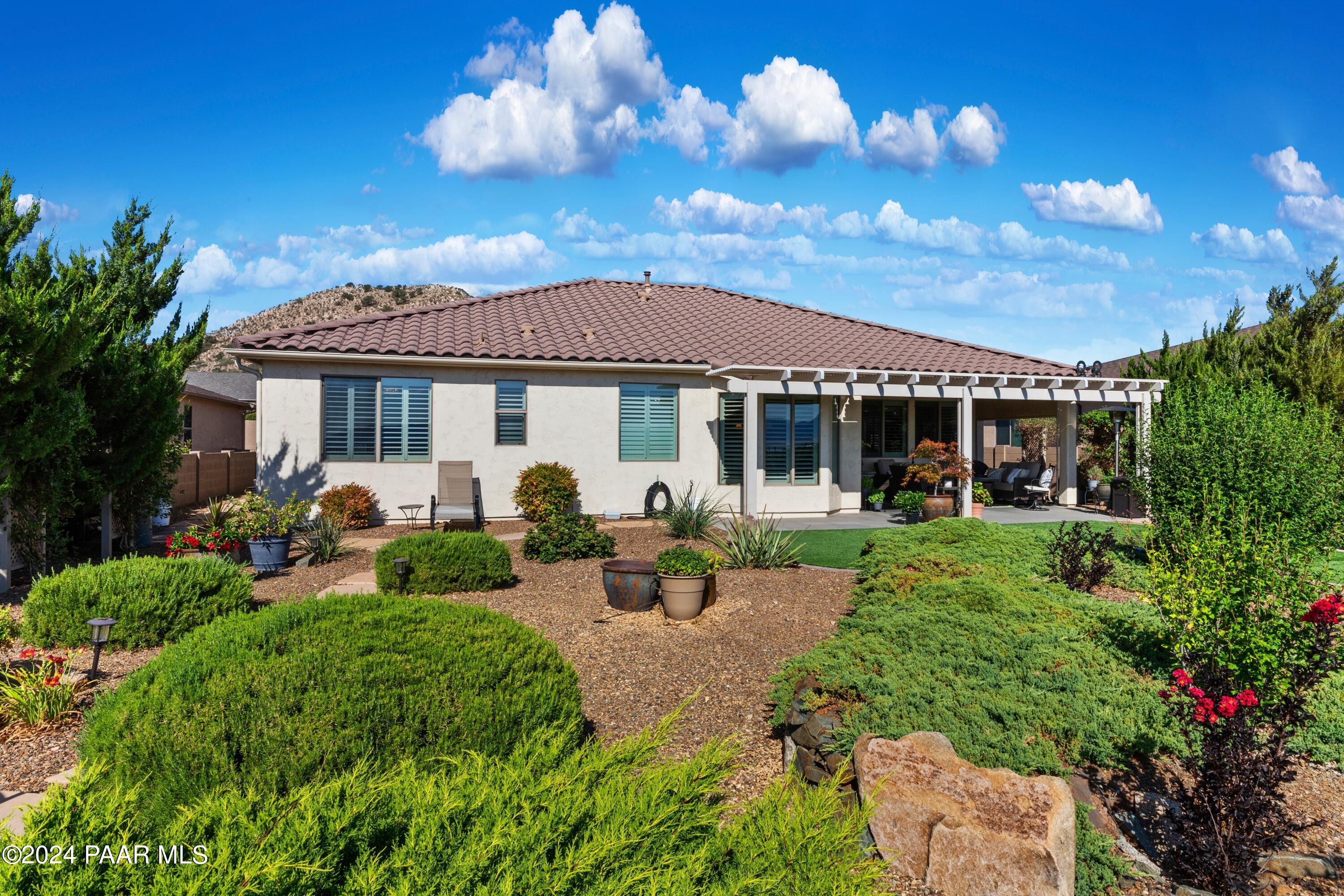 1219 Stack Rock Road Prescott Valley, AZ 86314 - Photo 31 of 41 a front view of a house with garden