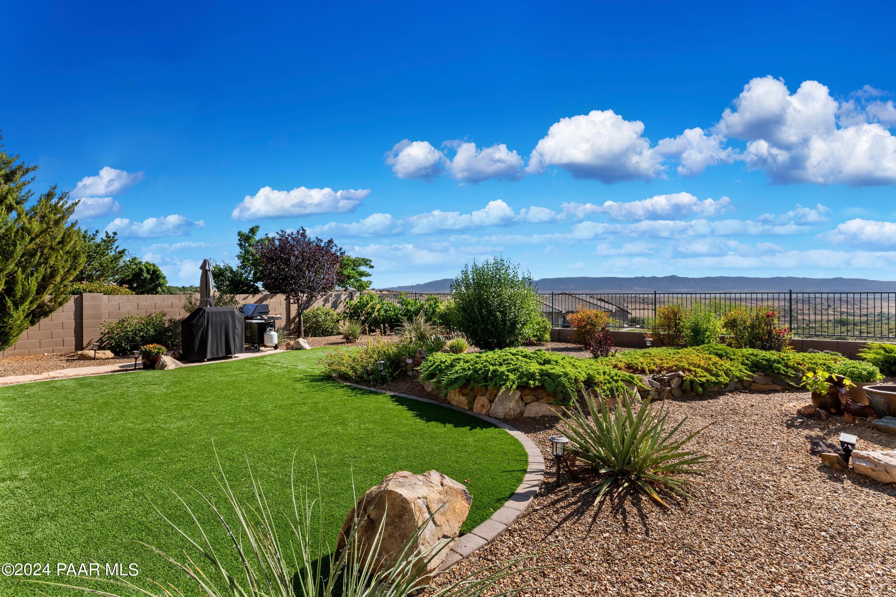 1219 Stack Rock Road Prescott Valley, AZ 86314 - Photo 32 of 41 a view of a golf course with chairs