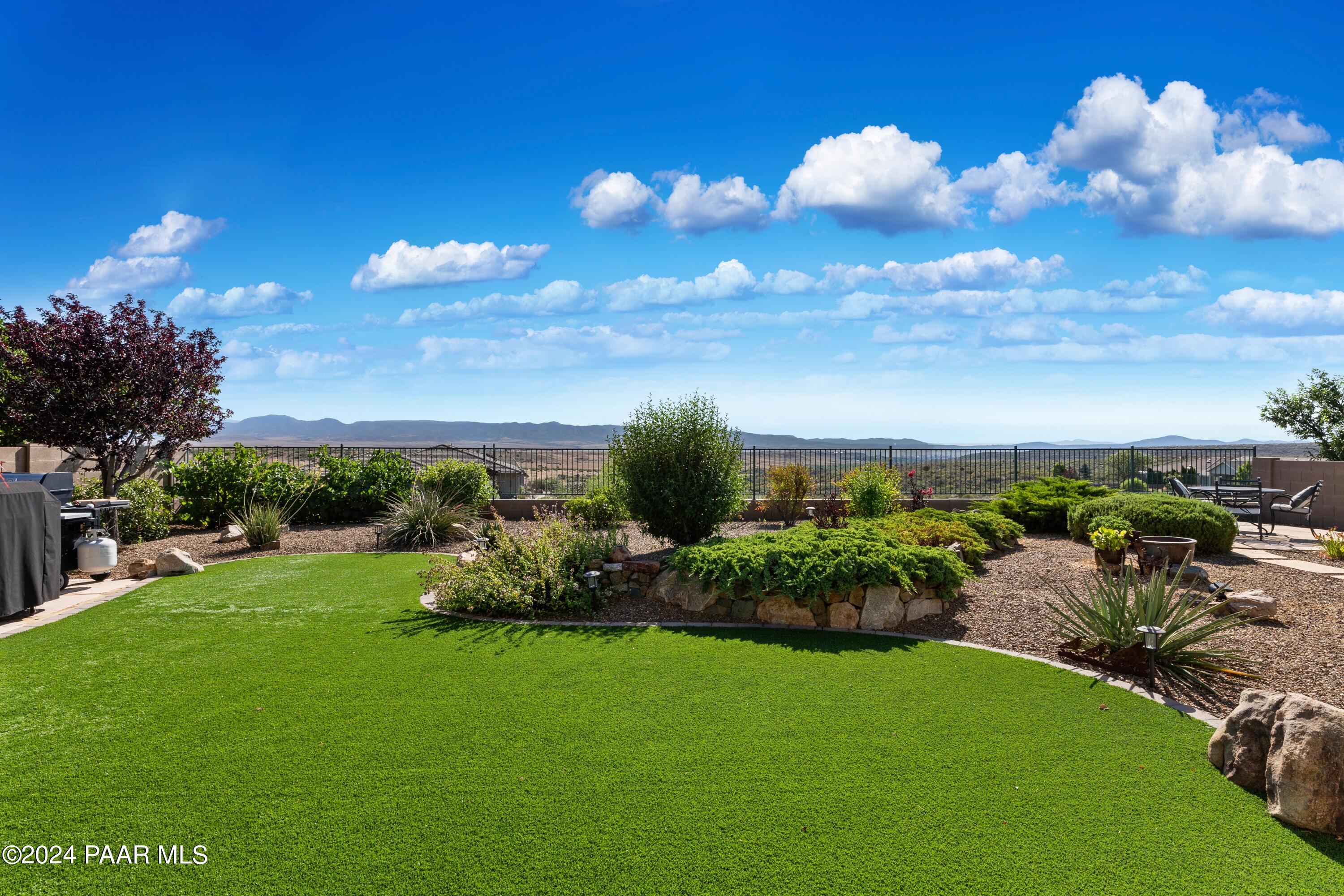 1219 Stack Rock Road Prescott Valley, AZ 86314 - Photo 33 of 41 a view of a golf course with a garden