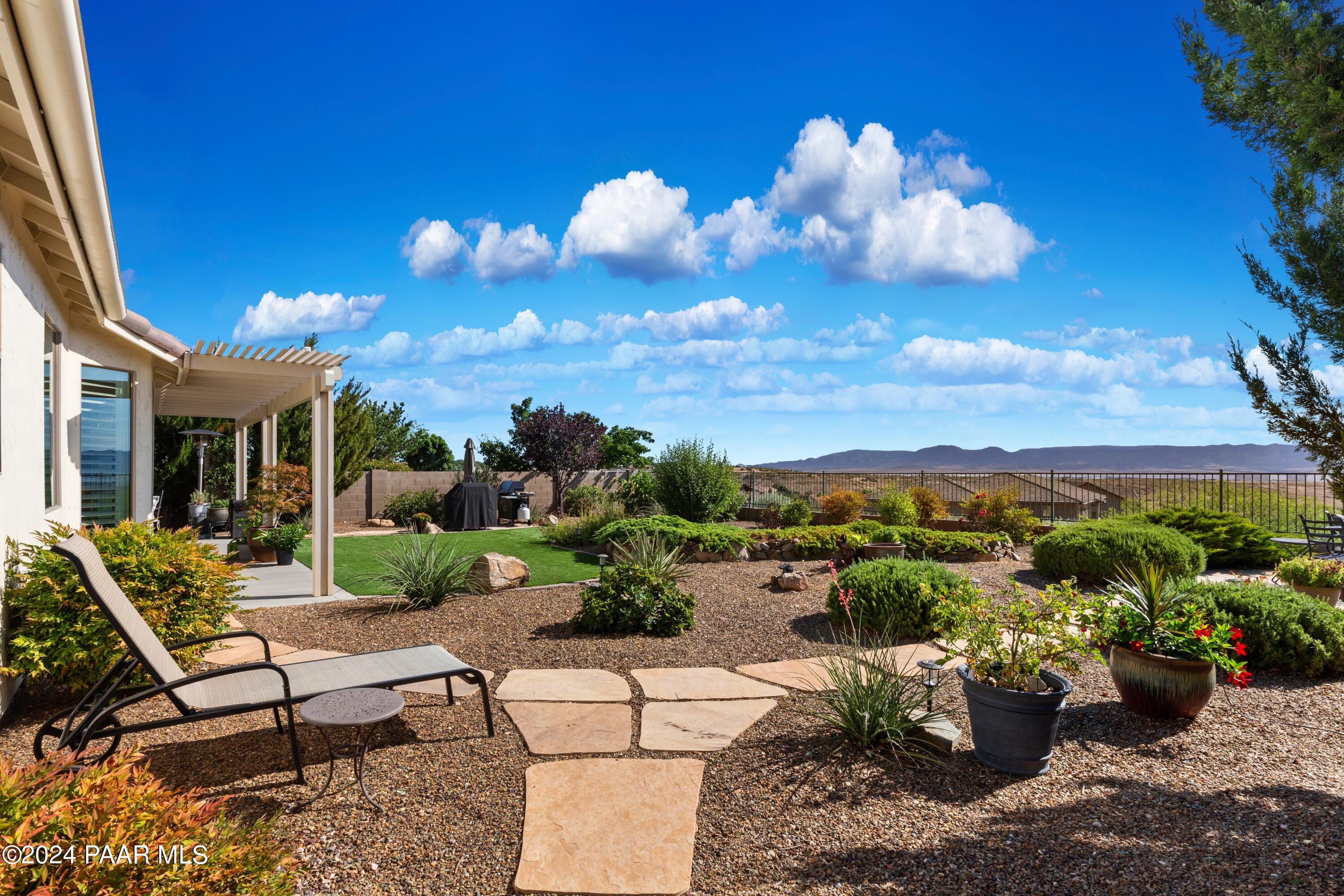 1219 Stack Rock Road Prescott Valley, AZ 86314 - Photo 35 of 41 a view of a patio with couches and potted plants