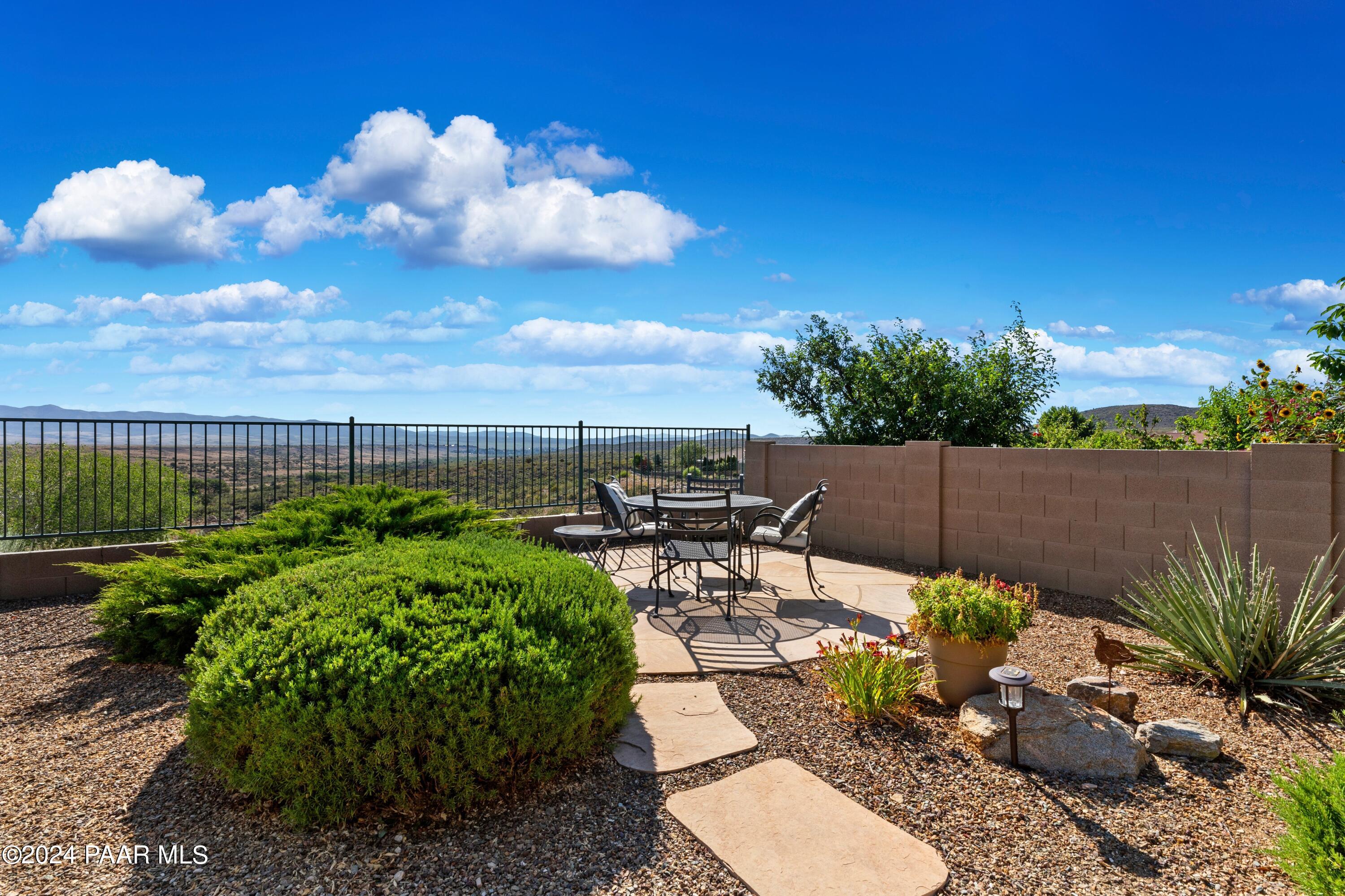1219 Stack Rock Road Prescott Valley, AZ 86314 - Photo 36 of 41 a view of a backyard with sitting area