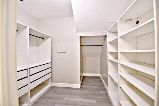 a view of a hallway with closet