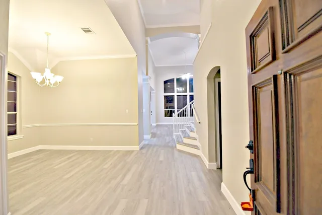 a view of livingroom with hardwood floor and staircase