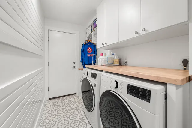 a utility room with dryer and washer