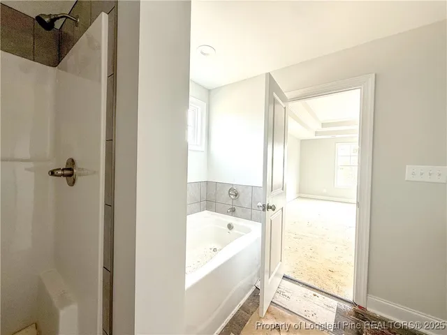 an empty room with a empty space and windows