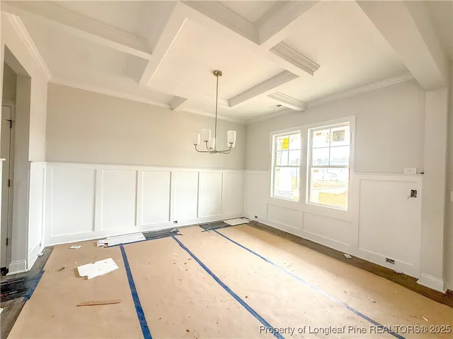 a spacious bedroom with a bed and a window