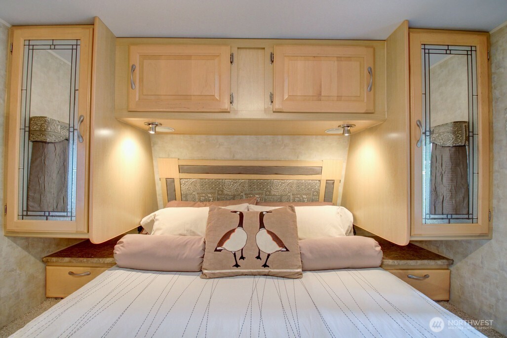 71 Wilderness Way Deming, WA 98244 - Photo 15 of 30 a bedroom with a bed and wooden floor