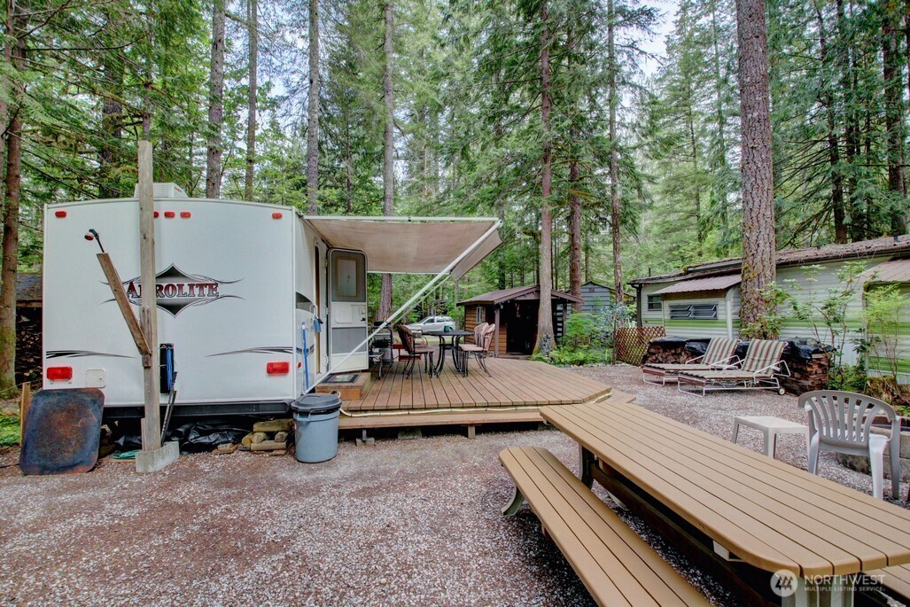 71 Wilderness Way Deming, WA 98244 - Photo 18 of 30 an outdoor space with furniture and a fireplace