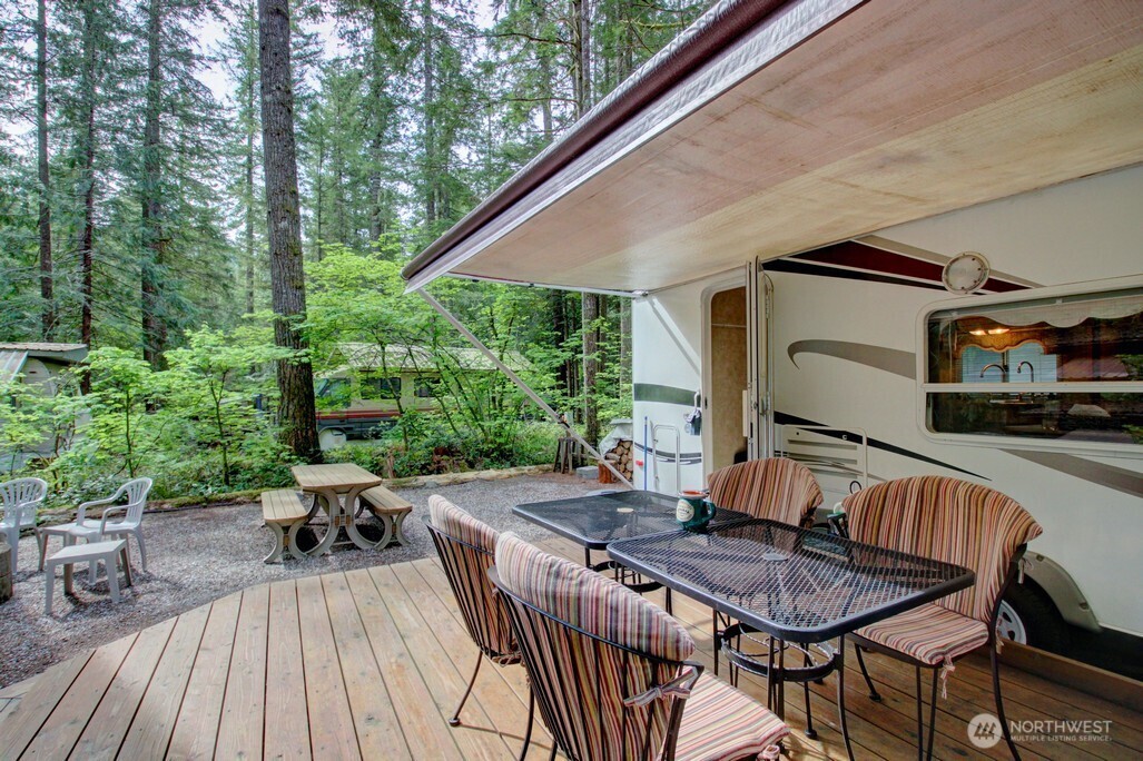 71 Wilderness Way Deming, WA 98244 - Photo 8 of 30 a view of backyard with outdoor seating a patio and plants