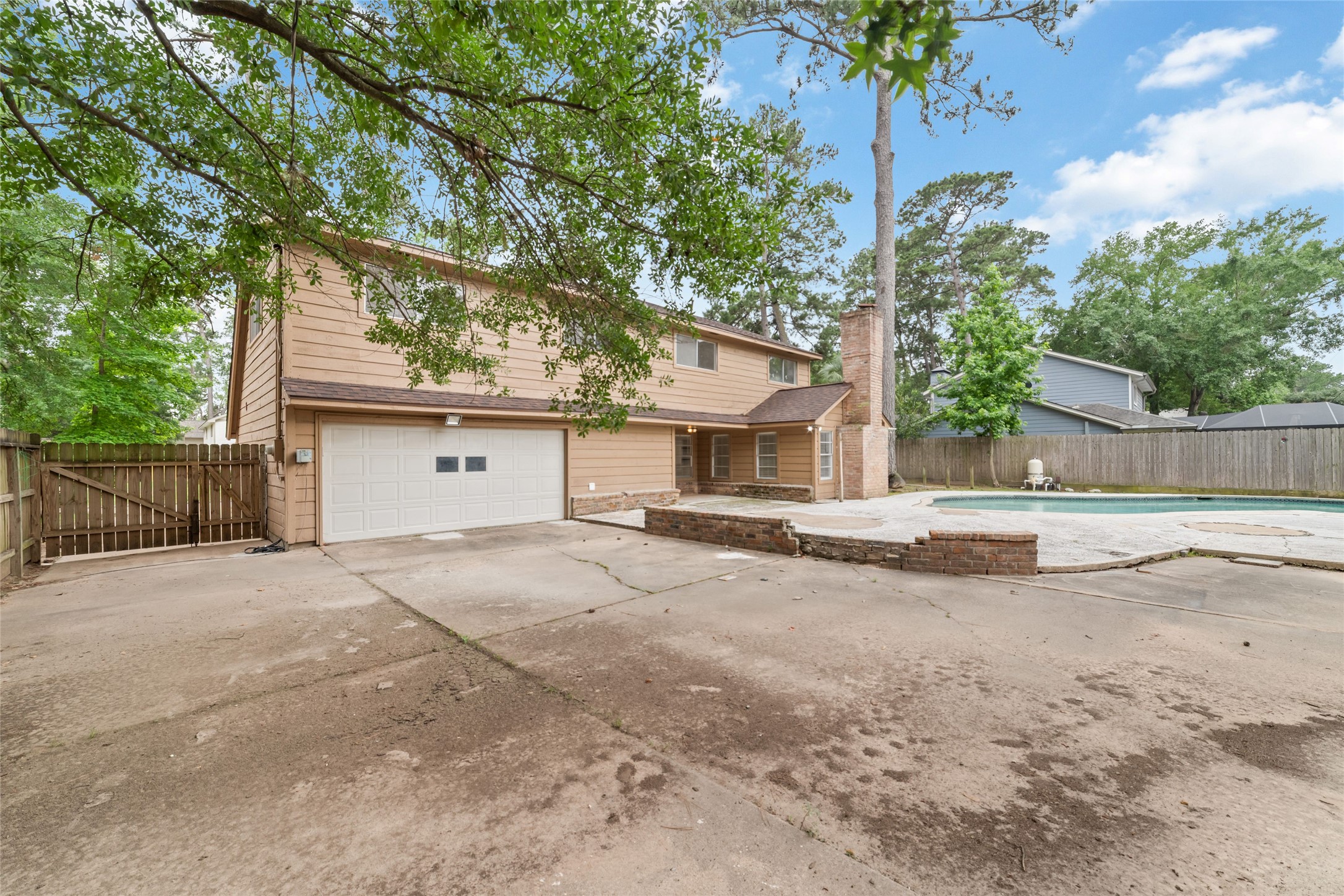 7910 Oak Moss Drive Spring, TX 77379 - Photo 27 of 38 With a garage facing the backyard, it can be used as a man cave or extra storage for the house.