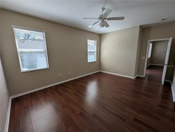a white toilet sitting next to a sink
