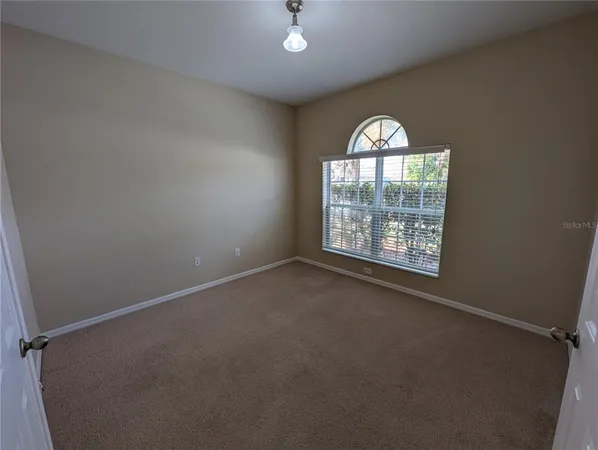 an empty room with closet area