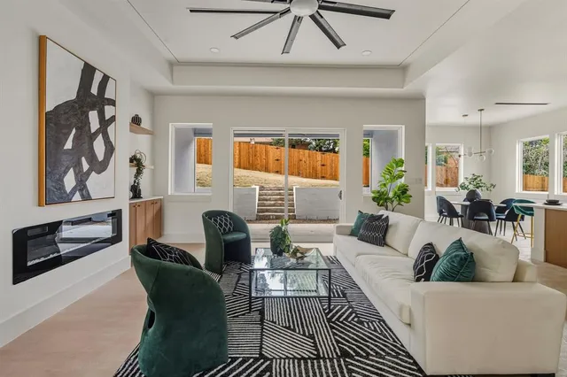 a living room with furniture and a rug