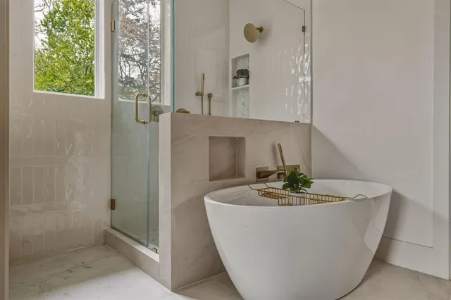 a white bath tub sitting in a bathroom