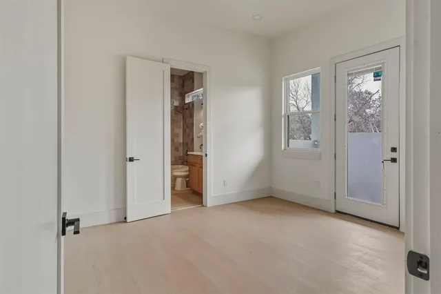 a bathroom with a granite countertop sink a toilet and bathtub