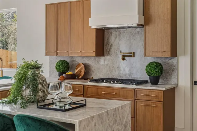 a kitchen with a stove and cabinets