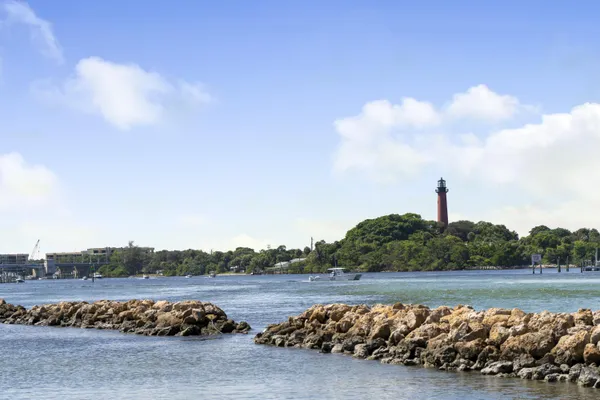 a view of a lake with houses in the back