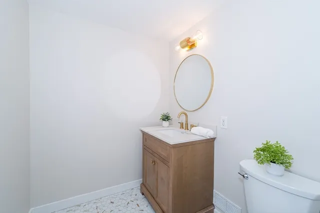 a view of entryway with wooden floor and stairs