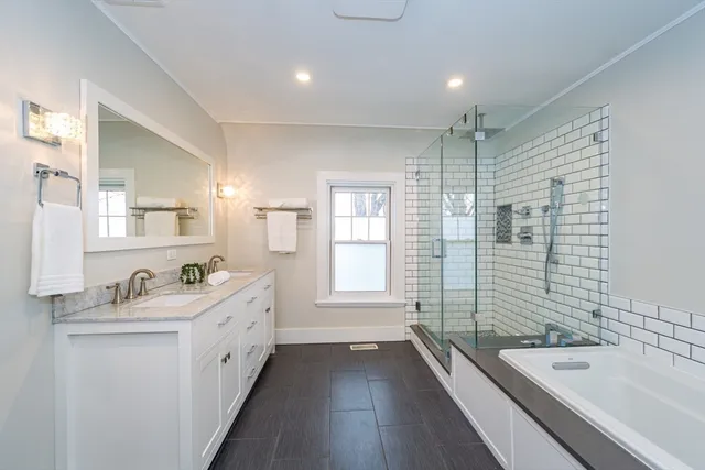 a bathroom with a granite countertop sink mirror and double